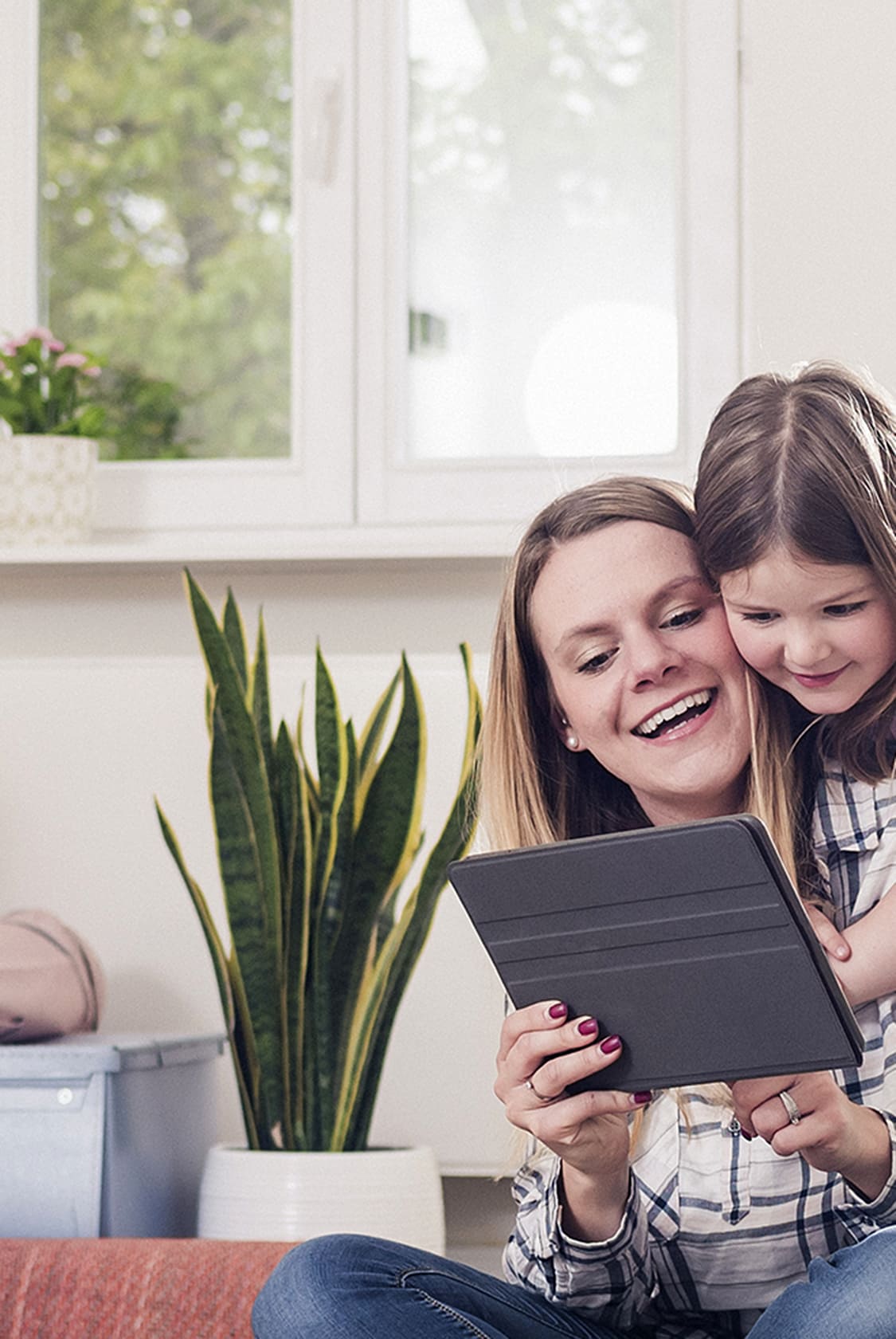 Family playing on wood-look flooring.